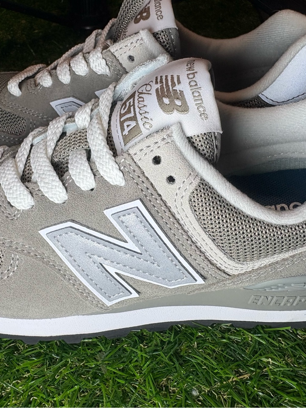 New Balance unisex style and color 574 size 5 women’s Sneakers in Light Gray